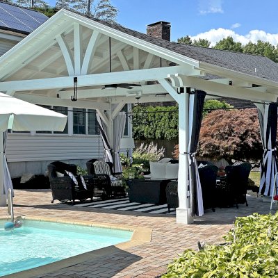 Del Norte Outdoor Kitchen Pavilion (Options: 15' L x 18' W, Mosaic Douglas-Fir, 4-Post Anchor Kit for Concrete, 9.5' H Posts, 1 Ceiling Fan Base, 1 Electrical Wiring Trim Kit, 4 Curtain Rods, White Stain Premium Sealant). Photo Courtesy of S. Leonard of Easton, MA.