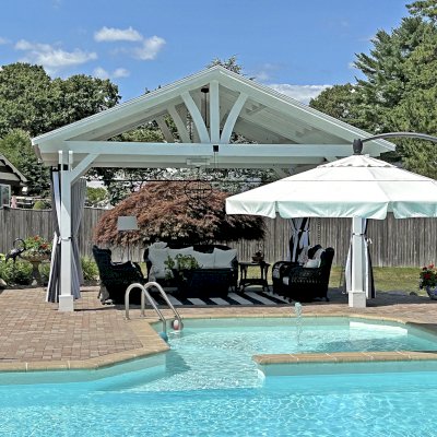 Del Norte Outdoor Kitchen Pavilion (Options: 15' L x 18' W, Mosaic Douglas-Fir, 4-Post Anchor Kit for Concrete, 9.5' H Posts, 1 Ceiling Fan Base, 1 Electrical Wiring Trim Kit, 4 Curtain Rods, White Stain Premium Sealant). Photo Courtesy of S. Leonard of Easton, MA.