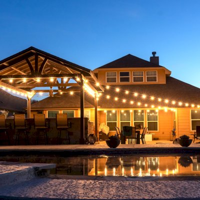 Del Norte Outdoor Kitchen Pavilion (Options: 20' L x 16' W, Mosaic Redwood, 4-Post Kit for Concrete, 1 Ceiling Fan Base, No Electrical Wiring Trim Kit, No Post Decorative Trims, Custom Sealant). Photo Courtesy of S. Oster of Round Rock, TX.