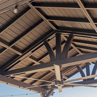 Del Norte Outdoor Kitchen Pavilion (Options: 20' L x 16' W, Mosaic Redwood, 4-Post Kit for Concrete, 1 Ceiling Fan Base, No Electrical Wiring Trim Kit, No Post Decorative Trims, Custom Sealant). Photo Courtesy of S. Oster of Round Rock, TX.