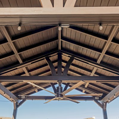 Del Norte Outdoor Kitchen Pavilion (Options: 20' L x 16' W, Mosaic Redwood, 4-Post Kit for Concrete, 1 Ceiling Fan Base, No Electrical Wiring Trim Kit, No Post Decorative Trims, Custom Sealant). Photo Courtesy of S. Oster of Round Rock, TX.