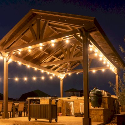 Del Norte Outdoor Kitchen Pavilion (Options: 20' L x 16' W, Mosaic Redwood, 4-Post Kit for Concrete, 1 Ceiling Fan Base, No Electrical Wiring Trim Kit, No Post Decorative Trims, Custom Sealant). Photo Courtesy of S. Oster of Round Rock, TX.