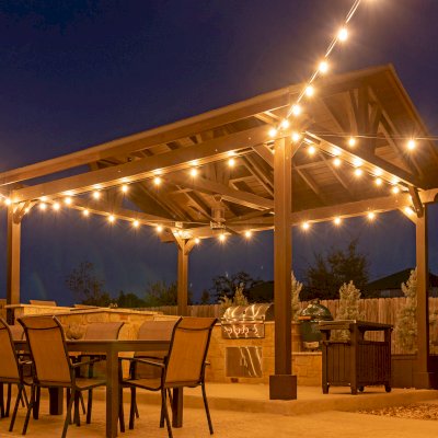 Del Norte Outdoor Kitchen Pavilion (Options: 20' L x 16' W, Mosaic Redwood, 4-Post Kit for Concrete, 1 Ceiling Fan Base, No Electrical Wiring Trim Kit, No Post Decorative Trims, Custom Sealant). Photo Courtesy of S. Oster of Round Rock, TX.