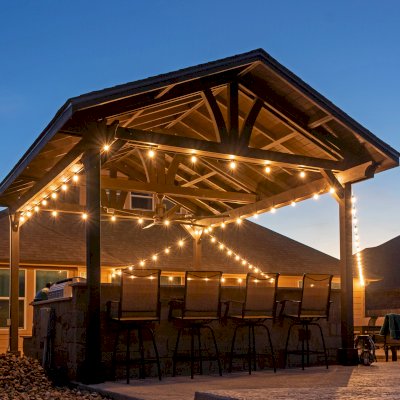 Del Norte Outdoor Kitchen Pavilion (Options: 20' L x 16' W, Mosaic Redwood, 4-Post Kit for Concrete, 1 Ceiling Fan Base, No Electrical Wiring Trim Kit, No Post Decorative Trims, Custom Sealant). Photo Courtesy of S. Oster of Round Rock, TX.