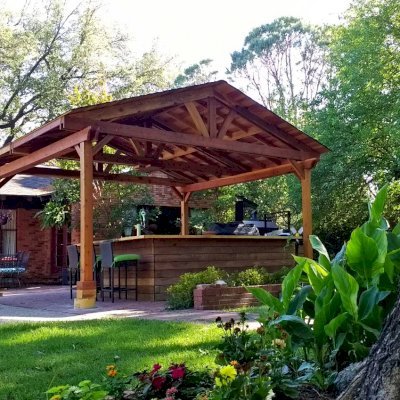 Del Norte Outdoor Kitchen Pavilion (Options: 18' L x 18' W, California Redwood, 4-Post Anchor Kit for Concrete, With a Ceiling Fan Base, Electrical Wiring Trim Kit for 2 Posts, Transparent Premium Sealant). Photo Courtesy of D. Blakelock of Dallas, TX.