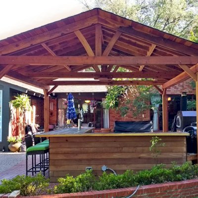 Del Norte Outdoor Kitchen Pavilion (Options: 18' L x 18' W, California Redwood, 4-Post Anchor Kit for Concrete, With a Ceiling Fan Base, Electrical Wiring Trim Kit for 2 Posts, Transparent Premium Sealant). Photo Courtesy of D. Blakelock of Dallas, TX.