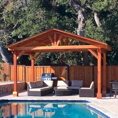 Del Norte Outdoor Kitchen Pavilion (Options: 11' L x 17' W, California Redwood, 4-Post Anchor Kit for Concrete, No Ceiling Fan Base, Transparent Premium Sealant). Roofing was still pending when shots taken just after assembly. Photo Courtesy of D. McCracken of Millbrae, CA.