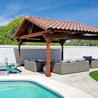 Del Norte Outdoor Kitchen Pavilion (Options: 18' L x 17' W, California Redwood, 4-Post Anchor Kit for Concrete, 9' H Posts, 1 Ceiling Fan Base, Coffee-Stain Premium Sealant, with 2x12's Supports and 2x8's Rafters). Photo Courtesy of K. Cashman of Scottsdale, Arizona.