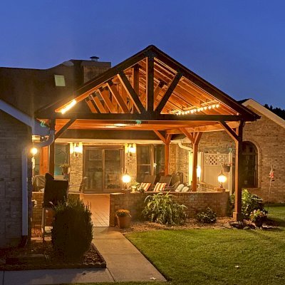 Del Norte Outdoor Kitchen Pavilion (Options: 26' L x 20' W, California Redwood, 6-Post Anchor Kit for High-Wind, Straight Internal Truss Supports by Custom Request, 2 Ceiling Fan Bases, 2 Electrical Wiring Trim Kits, No Post Decorative Trims, Transparent Premium Sealant, with Custom Steel Plating). Roof pitch increased beyond standard amount by customer request. Photo Courtesy of G. Dalby of Knoxville , Tennessee.