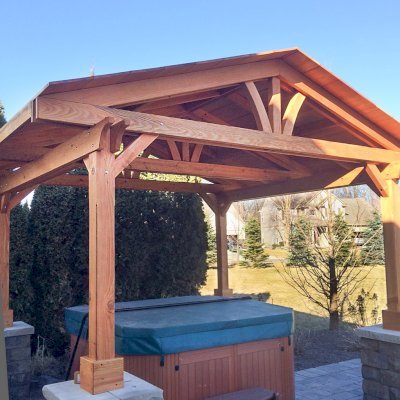 Del Norte Outdoor Kitchen Pavilion (Options: 14' L x 14' W, Douglas-fir, Posts Sitting Atop 33" H Load Bearing Columns, 4-Post Anchor Kit for Concrete, Transparent Premium Sealant). Photo Courtesy of Michael L. of S. Lyon, Michigan.