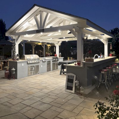 Del Norte Outdoor Kitchen Pavilion (Options: 16' L x 16' W, Douglas-fir, 4-Post Anchor Kit for High-Wind, 2 Fascia Boards, No Ceiling Fan Base, No Electrical Wiring Trim Kit, No Post Decorative Trims, Off-White Oil-Based Primer). Photo Courtesy of J. Felice of Cloverdale, CA.