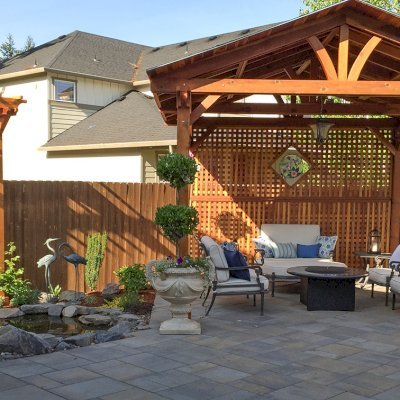 Del Norte Outdoor Kitchen Pavilion (Options: 14' L x 14' W, California Redwood, Unattached, 4-Post Anchor Kit for Concrete, Electrical Wiring Trim for 1 Post, 9' Posts, No Ceiling Fan Base, 2 Custom Privacy Panels, No Curtain Rods, Transparent Premium Sealant). Photo Also Shows a 2 Post Arbor with Custom Privacy Panels. Photo Courtesy of Michael Walti of Hillsboro, Oregon.