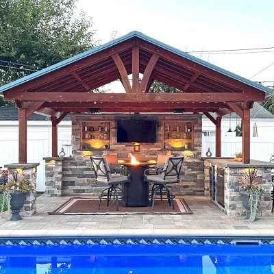 Del Norte Outdoor Kitchen Pavilion (Options: 12' L x 18' W, Douglas-fir, 4-Post Anchor Kit for High-Wind, 9' H Posts, 1 Ceiling Fan Base, No Fascia Boards, Electrical Wiring Trim Kit for 2 Posts, Transparent Premium Sealant). Photo Taken 3 Years After Installation. Photo Courtesy of S. Bono of Royal Oak, MI.