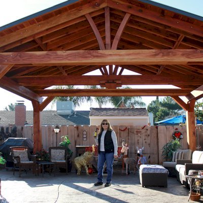 Del Norte Outdoor Kitchen Pavilion (Options: 16' L x 20' W, California Redwood, 4-Post Anchor Kit for High-Wind, With 1 Ceiling Fan Base, Electrical Wiring Trim Kit for 2 Posts, No Post Decorative Trim, Transparent Premium Sealant, 9 1/4" x 9 1/4" Posts & 1 1/2" x 9 1/4" Supports and Rafters by Custom Request). Photo Courtesy of P. Vejar of Merced, CA