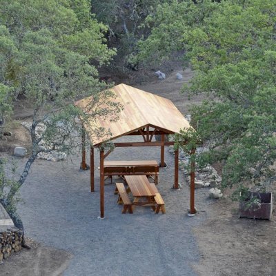 Del Norte Outdoor Kitchen Pavilion (Options: 28' L x 14' W, California Redwood, 6-Post Anchor Kit for Concrete, No Ceiling Fan Base, Transparent Premium Sealant) with 2 Picnic Table Sets with Benches. Photo Courtesy of Russ Dotson of The Oak Hill Ranch in Paicines, CA.