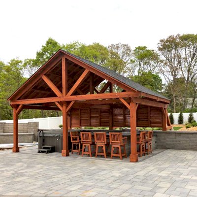 Del Rio Cathedral Ceiling Thick Timber Pavilion  (Options: 18' L x 26' W, California Redwood, 6-Post Anchor Kit for Concrete, Electrical Wiring Trim for 2 Posts, 9.5' Posts, 2 Ceiling Fan Bases, No Privacy Panels, No Curtain Rods, Transparent Premium Sealant, with Extra Knee Braces on the Back by Custom Request). Photo Courtesy of B. Poutre of North Falmouth, Massachusetts.