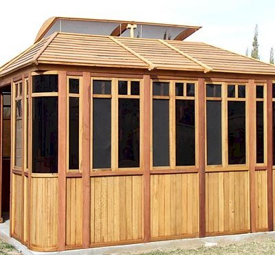 DIY Wood Gazebo (14' L, 12' W, Mature Redwood, Sliding Windows, 4' x 6' Skylight, 24" H Siding Below Windows, Vertical Siding, Japanese Doors, No Flooring, Transparent Premium Sealant). Custom detail: Roof overhang was minimized per customer request.