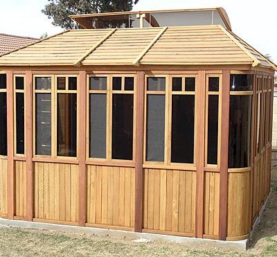 DIY Wood Gazebo (14' L, 12' W, Mature Redwood, Sliding Windows, 4' x 6' Skylight, 24" H Siding Below Windows, Vertical Siding, Japanese Doors, No Flooring, Transparent Premium Sealant). Custom detail: Roof overhang was minimized per customer request.