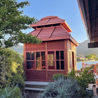 Dream Gazebos (Options: 9 ft Wall Height, 10' L, 14' W, Douglas-fir, All Sliding Windows with Screens, 4' x 6' Skylight, 36" H Siding Below Windows, Horizontal Siding, Japanese Doors with Screens, Complete Floor, Shiplap Roof, Cherry Stain Premium Sealant). Photo Courtesy of B. Victor of Larkspur of California.