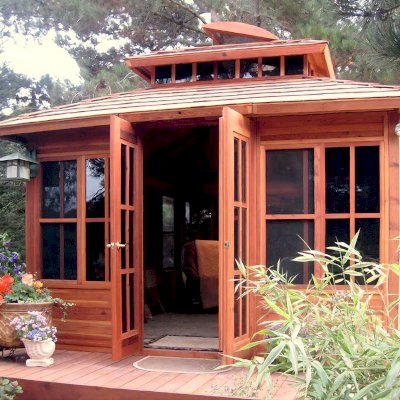 Dream Gazebos (Options: 7ft Wall Height, 14' L, 12' W, Mature Redwood, All Sliding Windows with Screens, 4' x 6' Skylight, 24" H Siding Below Windows, Horizontal Siding, French Doors, Complete Floor, Set of Shingles, Transparent Premium Sealant). Lighting not included.