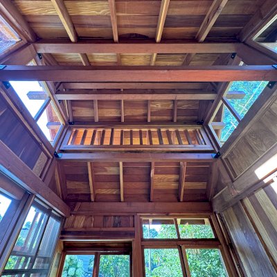Custom Dream Gazebos (Options: 9 ft Wall Height, 10' L, 14' W, California Redwood, Combination of Sliding Windows with Screens and Fixed Windows, No Skylight, 36" H Siding Below Windows, Vertical Siding, Roof Pitch 8:12, Japanese Doors with Screens, No Floor [Installed on an Existing Deck], Shiplap Roof, Transparent Premium Sealant). Photo Courtesy of J. & R. Griess of Omaha, NE.