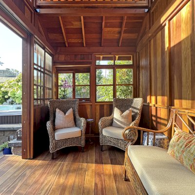 Custom Dream Gazebos (Options: 9 ft Wall Height, 10' L, 14' W, California Redwood, Combination of Sliding Windows with Screens and Fixed Windows, No Skylight, 36" H Siding Below Windows, Vertical Siding, Roof Pitch 8:12, Japanese Doors with Screens, No Floor [Installed on an Existing Deck], Shiplap Roof, Transparent Premium Sealant). Photo Courtesy of J. & R. Griess of Omaha, NE.