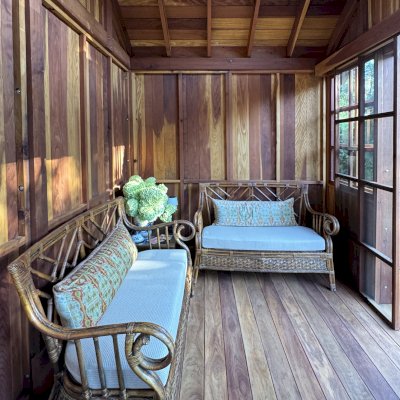 Custom Dream Gazebos (Options: 9 ft Wall Height, 10' L, 14' W, California Redwood, Combination of Sliding Windows with Screens and Fixed Windows, No Skylight, 36" H Siding Below Windows, Vertical Siding, Roof Pitch 8:12, Japanese Doors with Screens, No Floor [Installed on an Existing Deck], Shiplap Roof, Transparent Premium Sealant). Photo Courtesy of J. & R. Griess of Omaha, NE.