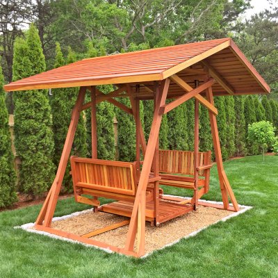 Dustin's Face to Face Gliders (Options: California Redwood, XW Roof, Without Beverage Armrest, No Kid's Platform, No Engraving, Transparent Premium Sealant). Photo Courtesy of C. Clairmont of Edgartown, Massachusetts.
