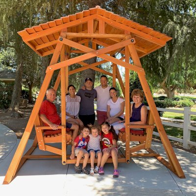 Dustin's Face to Face Gliders (Options: Douglas-fir, Standard Roof, Without Beverage Armrest, No Kid's Platform, Custom Engraving, Transparent Premium Sealant). Photo Courtesy of Gary & Kathy Dei Rossi of Manteca, CA..