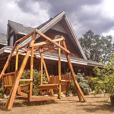 Dustin's Face to Face Gliders (Options: California Redwood, No Roof, Without Beverage Armrest, No Kid's Platform, No Engraving, Transparent Premium Sealant). Photo Courtesy of Coleen Dugan of Coarsegold, CA.