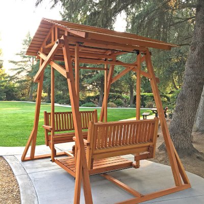 Dustin's Face to Face Gliders (Options: Douglas-fir, Standard Roof, Without Beverage Armrest, No Kid's Platform, Custom Engraving, Transparent Premium Sealant). Photo Courtesy of Gary & Kathy Dei Rossi of Manteca, CA..
