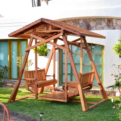 Dustin's Face to Face Gliders (Options: California Redwood, XW Roof, Without Beverage Armrest, No Kid's Platform, No Engraving, Transparent Premium Sealant). Photo Courtesy of El Estero Beach Resort of Ensenada, Baja. 