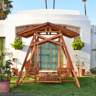 Dustin's Face to Face Gliders (Options: California Redwood, XW Roof, Without Beverage Armrest, No Kid's Platform, No Engraving, Transparent Premium Sealant). Photo Courtesy of El Estero Beach Resort of Ensenada, Baja. 
