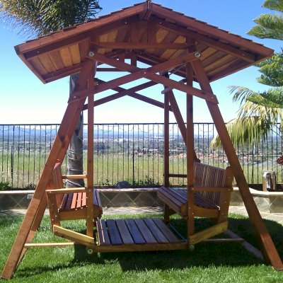 Dustin's Face to Face Gliders (Options: California Redwood, XW Roof, Without Beverage Armrest, No Kid's Platform, No Engraving, Transparent Premium Sealant). Photo Courtesy of Teresa D. Ali of San Jose, CA. 