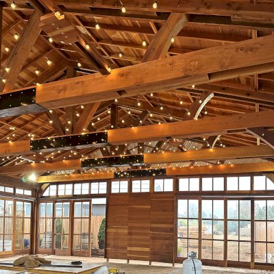 Custom El Paso Wedding Pavilion (Options: 50' L x 45' 6" W, California Redwood, 12' H Posts, 8-Post Anchor Kit for High-Wind, Transparent Premium Sealant). Custom sliding french doors and windows to enclose the structure were added by Forever Redwood during the design process. Photos Courtesy of T. Bruge of The Skyranch Lodge of Sedona, AZ.