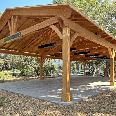 El Paso Wedding Pavilion (Options: 52'-7" x 26'-7", Douglas-Fir, 8-Post Anchor Kit for High-Wind, 8x8 Posts, 10' H Posts, Electrical Wiring Trim Kit for 4 Posts, with Ceiling Fan Base, with Fascia Boards, Transparent Premium Sealant). Photo Courtesy of J. Cooper of Oakland, CA.