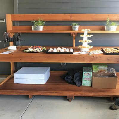 Custom Eli's Redwood Potting Bench (Options: 10' L x 36" W [Custom size], California Redwood, No Casters, One Shelf, No Drawers, No Fold Down Sides, No Engraving, No Lids, Transparent Premium Sealant). Photo Courtesy of B. Shanks of Salem, OR.