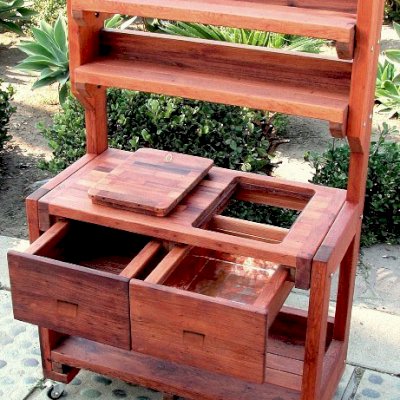 Eli's Redwood Potting Bench (Options: Standard Size, Old-Growth Redwood, Casters, 2 Shelves, Copper Inset for Right Drawer, No Engraving, Removable Lid on Right Side, Transparent Premium Sealant).  Photo shows tabletop lid removed.