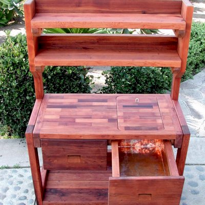 Eli's Redwood Potting Bench (Options: Standard Size, Old-Growth Redwood, Casters, 2 Shelves, Copper Inset for Right Drawer, No Engraving, Removable Lid on Right Side, Transparent Premium Sealant).  Photo shows tabletop lid removed.