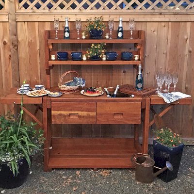 Eli's Redwood Potting Bench (Options: Large Size, California Redwood, No Casters, 2 Shelves, Both Sides Fold Down, Copper Inset for Right Drawer, No Engraving, Removable Slatted Lid Over Right Drawer, Transparent Premium Sealant). Photo Courtesy of M. Cooke of Westchester, IL.