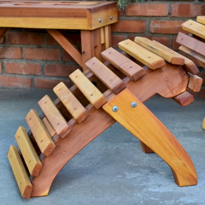 Ensenada Ottoman (Options: California Redwood, Transparent Premium Sealant). Lighthouse Bench & Ensenada Easychair in the background. 