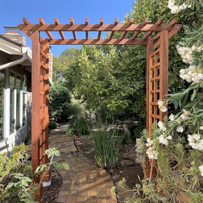 Entryway Arbor (Options: 96" W, 36" D, California Redwood, 4-Post Archor Kit for Concrete, Transparent Premium Sealant). Photo Courtesy of C. Baeuerlen of Los Altos, CA.