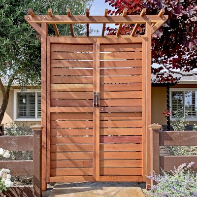 Custom Entryway Arbor with Custom Gate insted of Panels (Options: 78" W, 36" D, California Redwood, Transparent Premium Sealant). Photo Courtesy of C. Albert of Carpinteria, California.