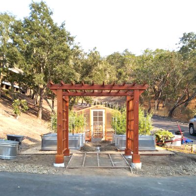 Custom Entryway Arbor (Options: 120" W, 84" D, California Redwood, 4-Post Archor Kit for Concrete, Transparent Premium Sealant) with 6 x 6 Posts and 2 x 6 Rafters by Custom Request. Photo Courtesy of K. Moore of Healdsburg, CA.