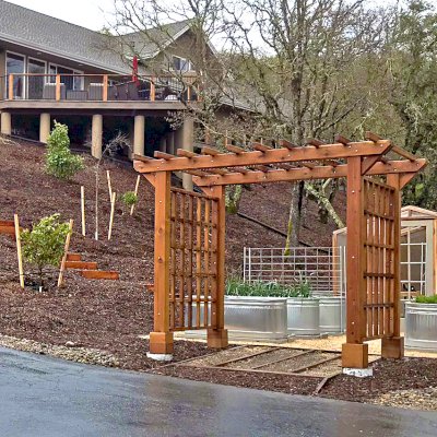 Custom Entryway Arbor (Options: 120" W, 84" D, California Redwood, 4-Post Archor Kit for Concrete, Transparent Premium Sealant) with 6 x 6 Posts and 2 x 6 Rafters by Custom Request. Photo Courtesy of K. Moore of Healdsburg, CA.