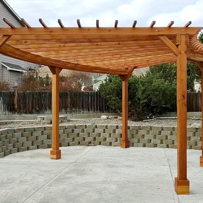 Fan Shaped Pergola Kit (Options: 22' x 20', California Redwood, With Roof Slats, No Electrical Wiring Trim Kit, 5-Post Anchor Kit for Concrete, No Ceiling Fan Base, 9.5' Posts, No Curtain Rods, Transparent Premium Sealant). Photo Courtesy of J. Knuvson of Wenatchee, Washington.