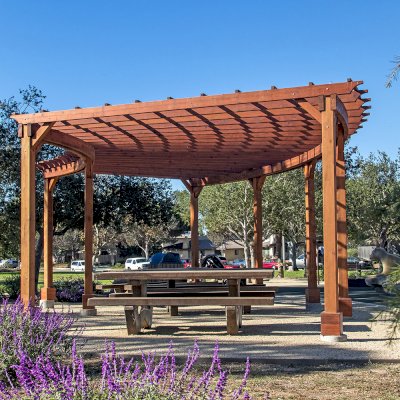 Fan Shaped Pergola Kit (Options: 35' x 16', Mature Redwood, With Roof Slats, No Electrical Wiring Trim Kit, 8-Post Anchor Kit for Concrete, No Ceiling Fan Base, 9.5' Posts, No Curtain Rods, Transparent Premium Sealant). Photo Courtesy of M. Roberts of Carpinteria, California.