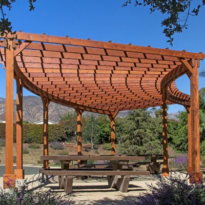 Fan Shaped Pergola Kit (Options: 35' x 16', Mature Redwood, With Roof Slats, No Electrical Wiring Trim Kit, 8-Post Anchor Kit for Concrete, No Ceiling Fan Base, 9.5' Posts, No Curtain Rods, Transparent Premium Sealant). Photo Courtesy of M. Roberts of Carpinteria, California.