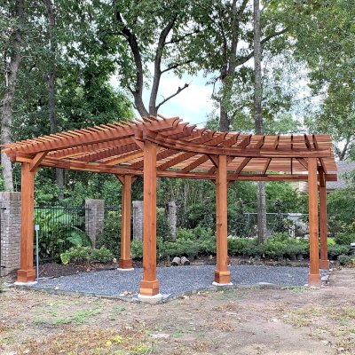 Fan Shaped Pergola Kit (Options: 28' x 12', California Redwood, With Roof Slats at 6", No Electrical Wiring Trim Kit, 7-Post Anchor Kit for Concrete, No Ceiling Fan Base, 9' Posts, No Curtain Rods, Transparent Premium Sealant). Photo Courtesy of Areté Landscape Design @ B. Pfeffer in Houston, TX.
