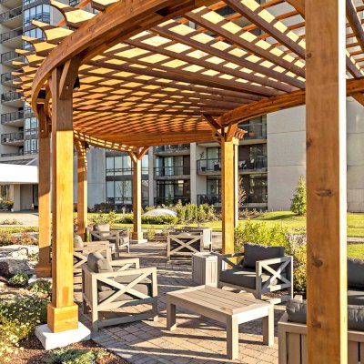 Fan Shaped Pergola Kit (Options: 38' x 14', California Redwood, With Roof Slats, 1 Electrical Wiring Trim Kit, 8-Post Anchor Kit for High-Wind, No Ceiling Fan Base, 10' Posts, No Curtain Rods, Transparent Premium Sealant). Photo Courtesy of A. Finnegan of Toronto, Ontario, Canada. 